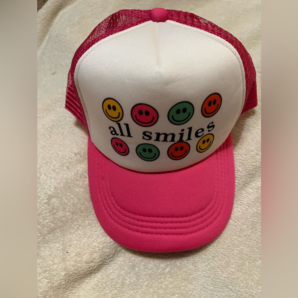 All Smiles pink smiley face Trucker hat .